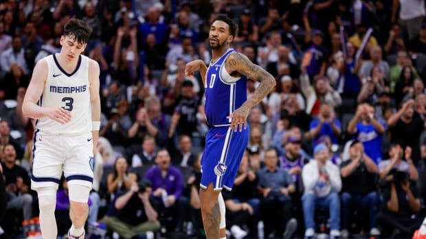Mar 18, 2024; Sacramento, California, USA; Sacramento Kings guard Malik Monk (0) celebrates after scoring a basket during overtime against the Memphis Grizzlies at Golden 1 Center. Mandatory Credit: Sergio Estrada-USA TODAY Sports